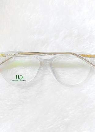 Armacao de óculos gatinho carolina herrera vhe772 transparente